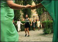 Sibell Bucko, 13, dances in a circle of women celebrating the birth of a baby girl in Prizren. Babinas, or parties for newborns, are one of the many social events reemerging as life returns to normal. - All images copyright Lisa Nipp 2010